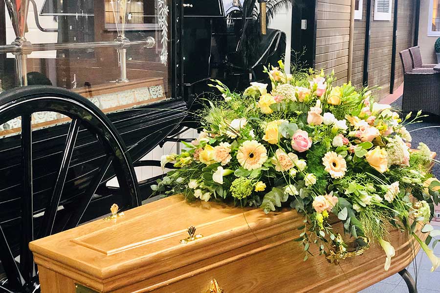 Funeral floral tribute on a coffin at Hopkinson